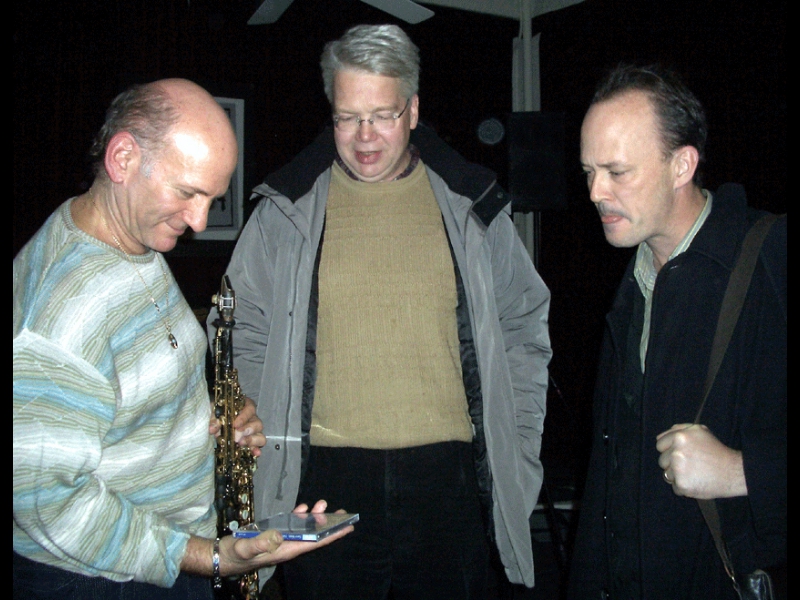 ZOHO artist Dave Liebman (left) at the Jazz Gallery, New York, on December 2, 2006 fellow ZOHO artist David Bixler (right) is dropping by, presenting Dave with a copy of his ZOHO CD.