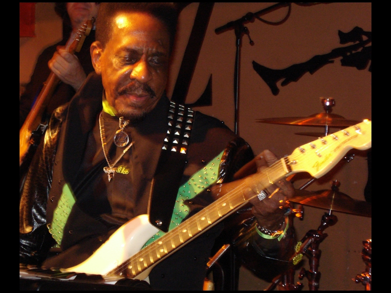 London, April 2007: ke Turner and the Kings of Rhythm on tour in Europe. Photo shows Ike giving one of his Fender guitars are solo work-out.