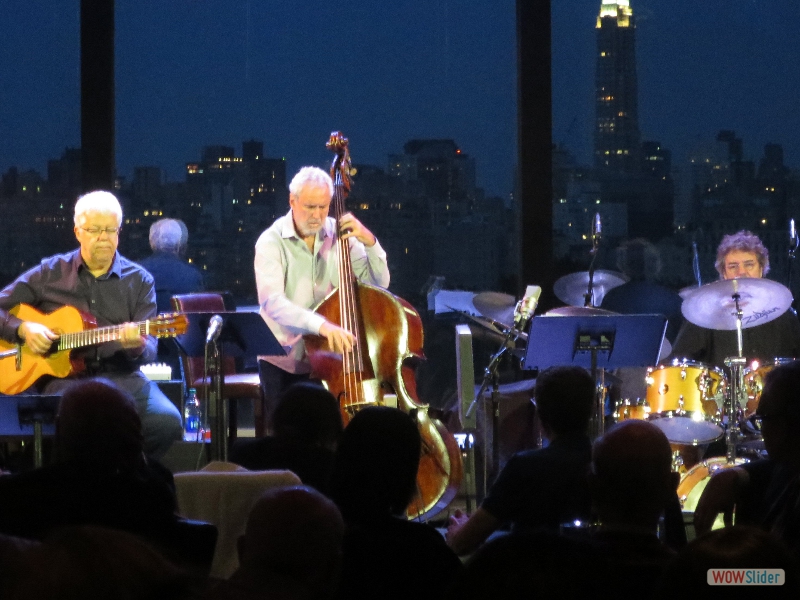 August 15, 2018: same set, same place, same band, an hour later. Look how the atmosphere has changed from twilight to night in the background. The sublime setting with the extraordinary music of Trio da Paz. Life does not get better than this.